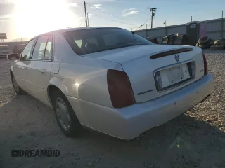 2001 Cadillac DeVille DHS z VIN 1G6KE57Y31U229255, wystawiony jako Copart lot #75101214 z przebiegiem 141 187 mil mil oraz Czysty tytuł • Clean title. Historia ofert i sprzedaży dostępna na DreamBid. Obrazek 2.