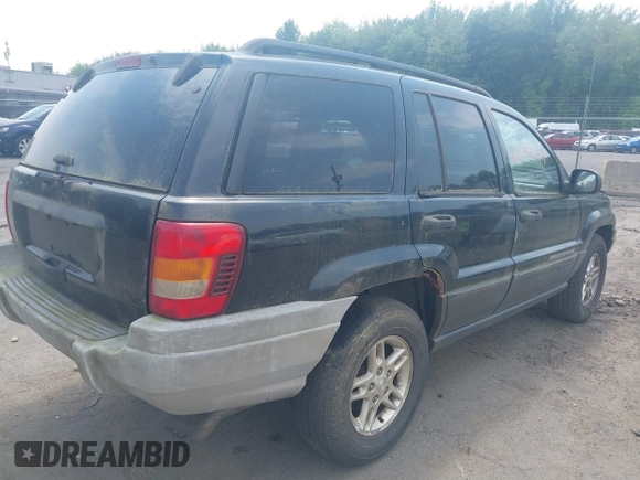 2003 Jeep Grand Cherokee Laredo with VIN 1J4GW48S03C557756, listed as a IAAI auction lot 42507884 with 195,236 mi miles and . Bid and sale history available at DreamBid. Image 4.