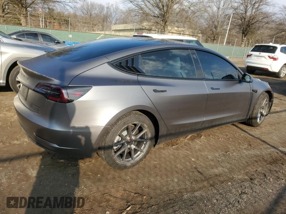 2022 Tesla Model 3 Long Range with VIN 5YJ3E1EBXNF272496, listed as a Copart auction lot 43973435 with 28,450 mi miles and Salvage Title. Bid and sale history available at DreamBid. Image 3.