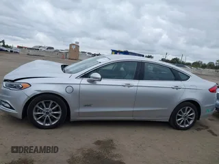 2017 Ford Fusion Energi SE with VIN 3FA6P0PU9HR354096, listed as a IAAI auction lot 42064703 with 69,601 mi miles. Bid and sale history available at carsss.com. Image 14.