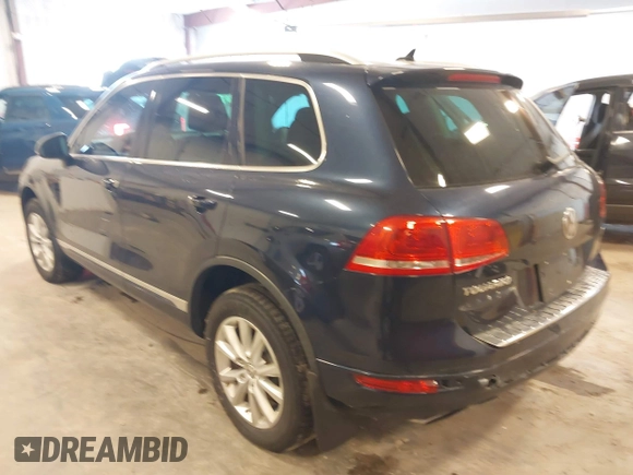 2014 Volkswagen Touareg Sport with VIN WVGEF9BP9ED008967, listed as a IAAI auction lot 41984409 with 193,859 mi miles and . Bid and sale history available at DreamBid. Image 3.