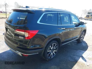 2022 Honda Pilot Touring 7-Passenger with VIN 5FNYF6H65NB030018, listed as a IAAI auction lot 41774147 with 57,391 mi miles. Bid and sale history available at carsss.com. Image 4.