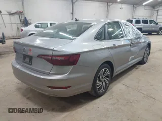 2021 Volkswagen Jetta SEL with VIN 3VWE57BUXMM056379, listed as a IAAI auction lot 42456450 with 34,697 mi miles and . Bid and sale history available at DreamBid. Image 4.