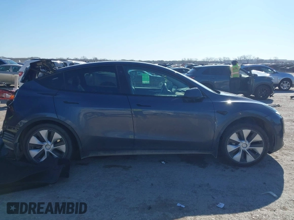 2023 Tesla Model Y Long Range with VIN 7SAYGAEE8PF667728, listed as a IAAI auction lot 41839771 with 32,654 mi miles and . Bid and sale history available at DreamBid. Image 13.
