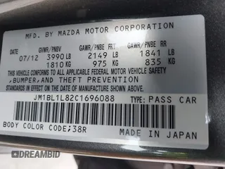 2012 Mazda Mazda3 i Touring with VIN JM1BL1L82C1696088, listed as a IAAI auction lot 41872228 with 111,629 mi miles. Bid and sale history available at carsss.com. Image 9.