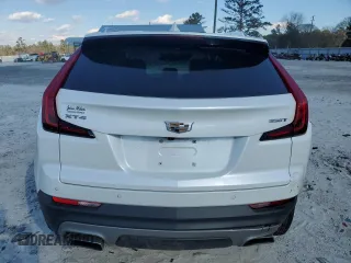 2022 Cadillac XT4 FWD Premium Luxury with VIN 1GYFZCR45NF100049, listed as a Copart auction lot 87232634 with 62,391 mi miles and Salvage title. Bid and sale history available at DreamBid. Image 6.