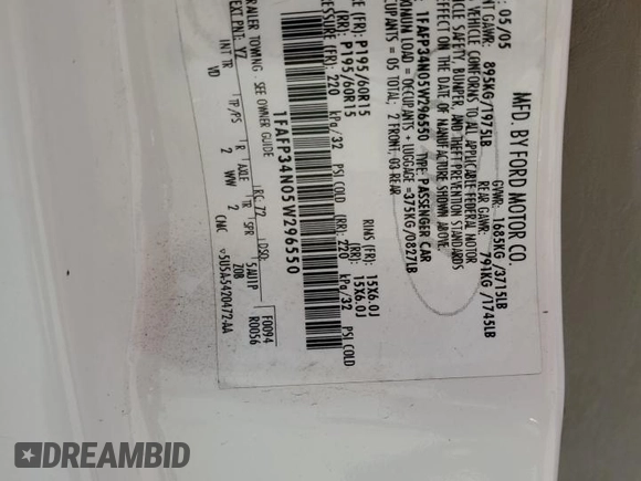 2005 Ford Focus S with VIN 1FAFP34N05W296550, listed as a Copart auction lot 59391835 with 216,509 mi miles and Salvage title. Bid and sale history available at DreamBid. Image 13.
