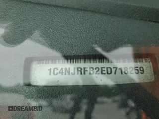 2014 Jeep Patriot Latitude with VIN 1C4NJRFB2ED718259, listed as a Copart auction lot 58095825 with 116,665 mi miles and Salvage title. Bid and sale history available at DreamBid. Image 13.
