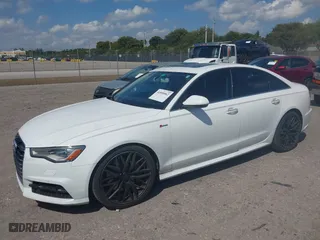 2016 Audi A6 3.0T Premium Plus with VIN WAUFGAFC9GN003664, listed as a IAAI auction lot 41890962 with 100,485 mi miles. Bid and sale history available at carsss.com. Image 2.