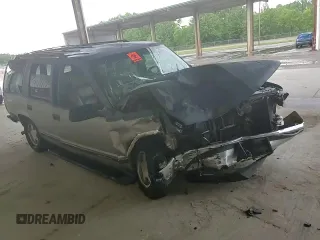 1999 GMC Yukon with VIN 1GKEC13R4XJ735246, listed as a Copart auction lot 56429874 with 258,616 mi miles and Salvage Title. Bid and sale history available at carsss.com. Image 12.