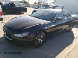 2014 Maserati Ghibli z VIN ZAM57XSA5E1083924, wystawiony jako Copart lot #89027085 z przebiegiem 100 487 mil mil oraz Tytuł czysty. Historia ofert i sprzedaży dostępna na DreamBid. Obrazek 1.