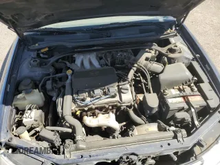 2000 Toyota Solara SE z VIN 2T1CF28P0YC350027, wystawiony jako Copart lot #52181555 z przebiegiem 220 178 mil mil oraz Szkoda całkowita • Salvage title. Historia ofert i sprzedaży dostępna na DreamBid. Obrazek 11.