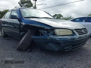 1999 Toyota Camry LE z VIN JT2BF22K2X0164080, wystawiony jako IAAI lot #40984874 z przebiegiem Nie podano mil oraz . Historia ofert i sprzedaży dostępna na DreamBid. Obrazek 6.