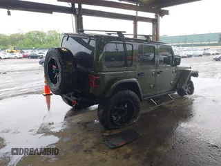 2021 Jeep Wrangler Unlimited Rubicon with VIN 1C4HJXFG4MW543254, listed as a IAAI auction lot 42316180 with 50,696 mi miles and . Bid and sale history available at DreamBid. Image 4.