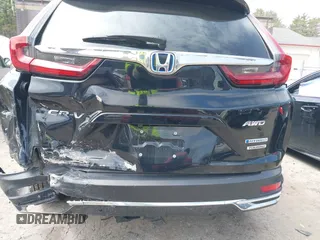 2020 Honda CR-V Touring with VIN 7FART6H96LE023782, listed as a IAAI auction lot 42053948 with 56,814 mi miles and . Bid and sale history available at DreamBid. Image 6.