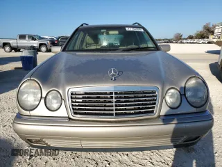 1998 Mercedes-Benz E-Class with VIN WDBJH65F9WA597132, listed as a Copart auction lot 77780094 with 0 mi miles and Salvage Title. Bid and sale history available at carsss.com. Image 5.