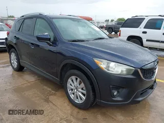 2015 Mazda CX-5 Touring with VIN JM3KE2CY5F0449195, listed as a IAAI auction lot 41894567 with 124,694 mi miles and . Bid and sale history available at carsss.com. Image 1.