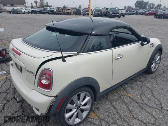 2013 MINI Coupe S with VIN WMWSX3C53DT466648, listed as a IAAI auction lot 41719597 with 106,936 mi miles and . Bid and sale history available at DreamBid. Image 4.