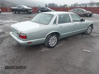 1998 Jaguar XJ with VIN SAJHN1242WC819689, listed as a IAAI auction lot 41148530 with 60,143 mi miles and . Bid and sale history available at DreamBid. Image 4.