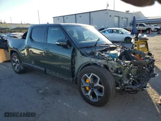 2022 Rivian R1T Adventure Package with VIN 7FCTGAAA5NN007049, listed as a Copart auction lot 74857974 with 27,481 mi miles and Salvage Title. Bid and sale history available at carsss.com. Image 4.