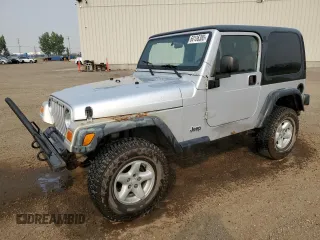2003 Jeep Wrangler Sport z VIN 1J4FA49S93P306817, wystawiony jako Copart lot #60136385 z przebiegiem 217 208 mil mil oraz Czysty tytuł • Clean title. Historia ofert i sprzedaży dostępna na DreamBid. Obrazek 1.