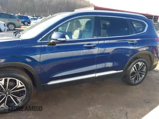 2019 Hyundai Santa Fe Ultimate with VIN 5NMS5CAA6KH117104, listed as a IAAI auction lot 41639157 with 75,507 mi miles and . Bid and sale history available at DreamBid. Image 14.