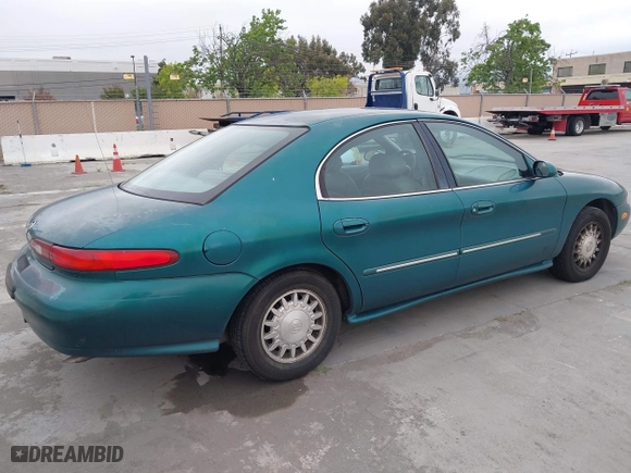 1996 Mercury Sable LS with VIN 1MELM53S0TG600877, listed as a IAAI auction lot 42063937 with 200,405 mi miles. Bid and sale history available at carsss.com. Image 4.