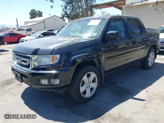 2011 Honda Ridgeline RTL with VIN 5FPYK1F50BB001442, listed as a IAAI auction lot 42023615 with 189,170 mi miles. Bid and sale history available at carsss.com. Image 2.