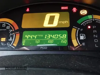 2005 Honda Insight z VIN JHMZE14725S000209, wystawiony jako IAAI lot #41542749 z przebiegiem 134 058 mil mil oraz . Historia ofert i sprzedaży dostępna na DreamBid. Obrazek 16.