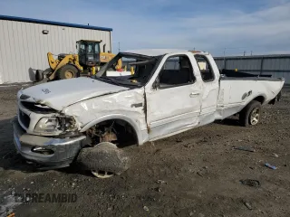 1997 Ford F-150 XL with VIN 1FTDX1869VKA43999, listed as a Copart auction lot 42239815 with 145,238 mi miles and Salvage Title. Bid and sale history available at carsss.com. Image 1.