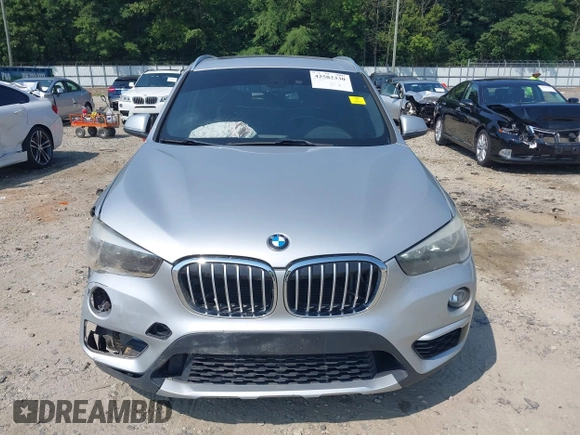 2018 BMW X1 xDrive28i with VIN WBXHT3C39J5L27926, listed as a IAAI auction lot 42582330 with 101,197 mi miles and . Bid and sale history available at DreamBid. Image 12.