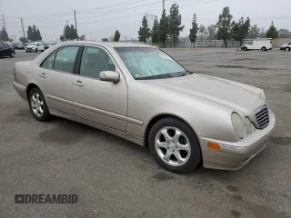 2002 Mercedes-Benz E-Class with VIN WDBJF65J92B404315, listed as a Copart auction lot 75481094 with 87,383 mi miles and Salvage Title. Bid and sale history available at carsss.com. Image 4.