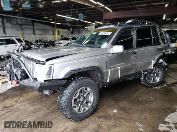 1998 Jeep Grand Cherokee Limited with VIN 1J4GZ78S9WC308708, listed as a Copart auction lot 79315694 with 205,976 mi miles and Salvage title. Bid and sale history available at DreamBid. Image 1.