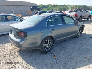 2006 Volkswagen Jetta 2.5L z VIN 3VWSF71K06M798437, wystawiony jako IAAI lot #42559453 z przebiegiem 169 485 mil mil oraz . Historia ofert i sprzedaży dostępna na DreamBid. Obrazek 4.