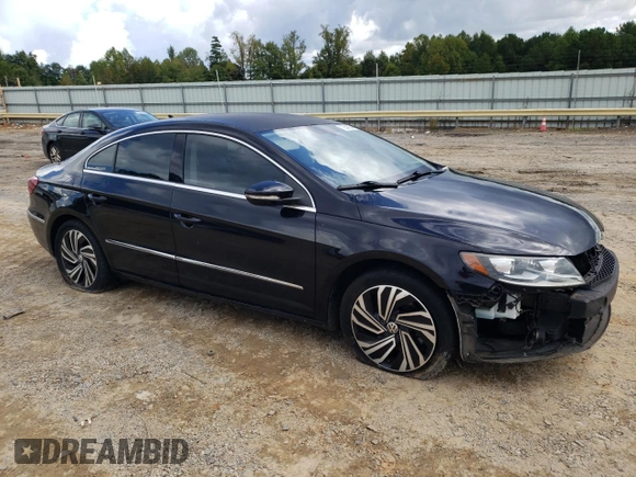 2014 Volkswagen CC R-Line with VIN WVWBP7AN9EE501261, listed as a Copart auction lot 75701194 with 73,123 mi miles and Salvage Title. Bid and sale history available at carsss.com. Image 4.
