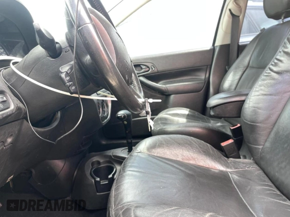 2006 Ford Focus S z VIN 1FAHP37N36W176473, wystawiony jako Copart lot #53781985 z przebiegiem 154 954 mil mil oraz Szkoda całkowita • Salvage title. Historia ofert i sprzedaży dostępna na DreamBid. Obrazek 7.