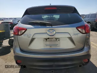 2014 Mazda CX-5 Grand Touring with VIN JM3KE4DY4E0305212, listed as a Copart auction lot 53145305 with 233,061 mi miles and Salvage Title. Bid and sale history available at carsss.com. Image 6.