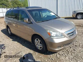2006 Honda Odyssey EX-L with VIN 5FNRL38666B410188, listed as a IAAI auction lot 42004957 with 156,584 mi miles. Bid and sale history available at carsss.com. Image 1.