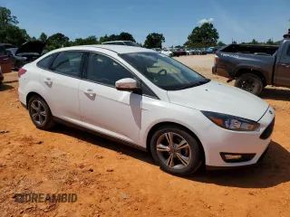 2018 Ford Focus SE with VIN 1FADP3FE9JL264664, listed as a Copart auction lot 61726905 with 28,471 mi miles and Salvage title. Bid and sale history available at DreamBid. Image 4.