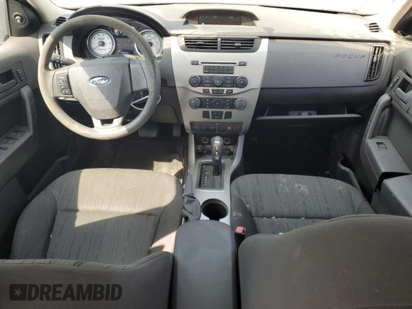 2009 Ford Focus SE with VIN 1FAHP35N69W173977, listed as a Copart auction lot 69018554 with 138,496 mi miles and Salvage Title. Bid and sale history available at DreamBid. Image 8.