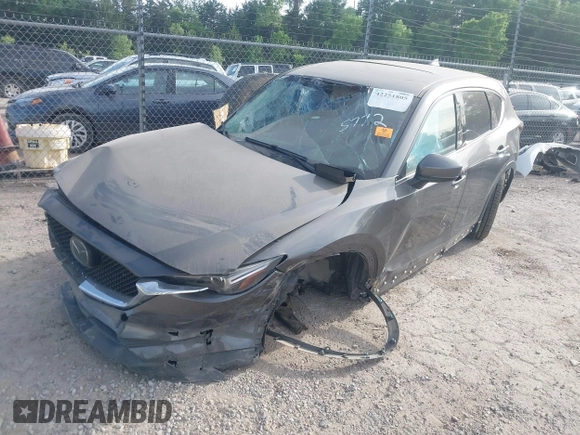 2018 Mazda CX-5 Grand Touring z VIN JM3KFADM5J1365772, wystawiony jako IAAI lot #42251805 z przebiegiem 44 599 mil mil oraz . Historia ofert i sprzedaży dostępna na DreamBid. Obrazek 16.