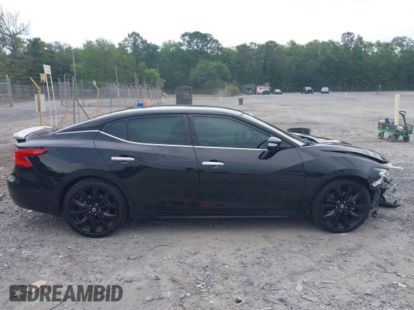 2018 Nissan Maxima Platinum z VIN 1N4AA6AP9JC392479, wystawiony jako IAAI lot #42209148 z przebiegiem 103 710 mil mil oraz . Historia ofert i sprzedaży dostępna na DreamBid. Obrazek 13.