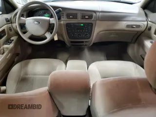 2007 Ford Taurus SE with VIN 1FAFP53U17A150484, listed as a Copart auction lot 56642465 with Not provided miles and Clean title. Bid and sale history available at DreamBid. Image 8.