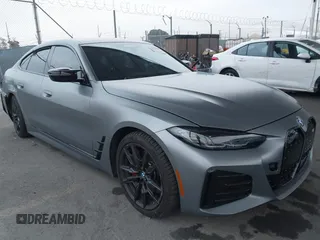 2023 BMW i4 M50 with VIN WBY33AW01PFP51468, listed as a IAAI auction lot 41177008 with 15,465 mi miles. Bid and sale history available at carsss.com. Image 1.