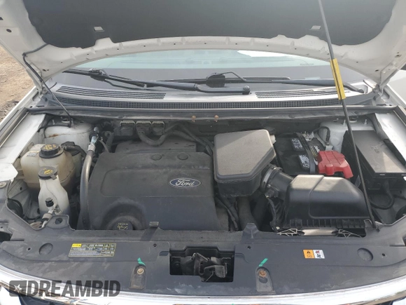 2013 Ford Edge SEL z VIN 2FMDK4JCXDBA38217, wystawiony jako Copart lot #58256755 z przebiegiem 151 551 mil mil oraz Szkoda całkowita • Salvage title. Historia ofert i sprzedaży dostępna na DreamBid. Obrazek 11.