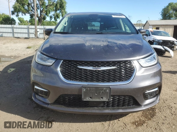 2023 Chrysler Pacifica Hybrid Touring L with VIN 2C4RC1L79PR608659, listed as a Copart auction lot 56945365 with 45,697 mi miles and Salvage title. Bid and sale history available at DreamBid. Image 5.