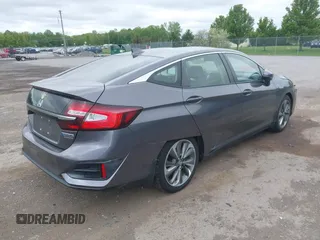 2018 Honda Clarity Touring z VIN JHMZC5F3XJC001054, wystawiony jako IAAI lot #42292688 z przebiegiem 60 780 mil mil oraz . Historia ofert i sprzedaży dostępna na DreamBid. Obrazek 4.