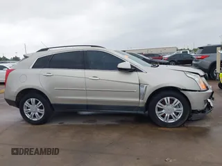 2015 Cadillac SRX z VIN 3GYFNAE37FS597695, wystawiony jako IAAI lot #42184666 z przebiegiem 106 210 mil mil oraz . Historia ofert i sprzedaży dostępna na DreamBid. Obrazek 13.