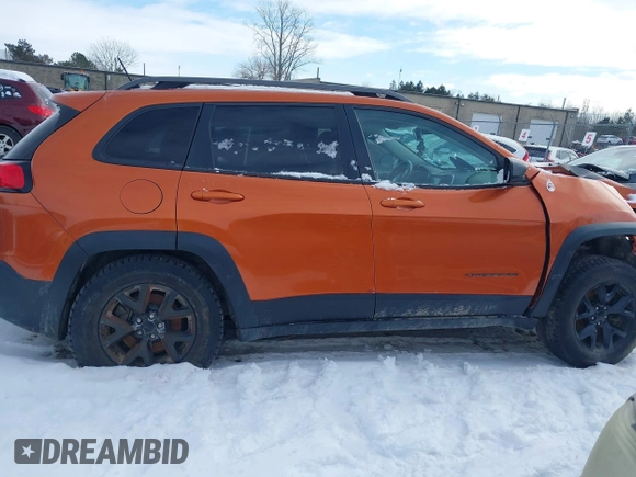 2015 Jeep Cherokee Trailhawk with VIN 1C4PJMBS9FW655233, listed as a IAAI auction lot 41430715 with 138,181 mi miles and . Bid and sale history available at carsss.com. Image 14.