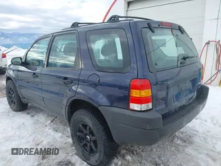 2003 Ford Escape XLS Popular with VIN 1FMYU92153KE01890, listed as a IAAI auction lot 41605087 with 109,411 mi miles. Bid and sale history available at carsss.com. Image 3.